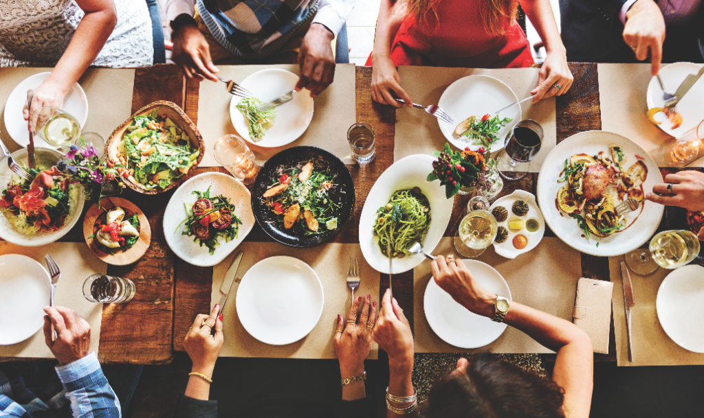 Friends eating at table